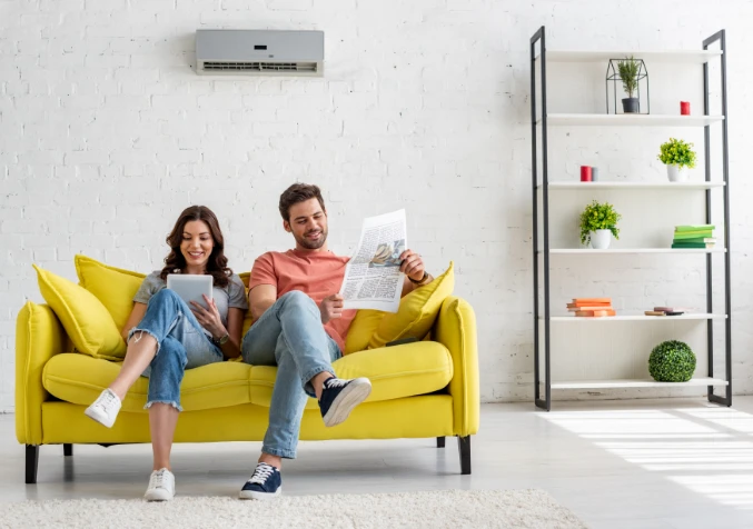 couple enjoying cool air from freshly cleaned aircon