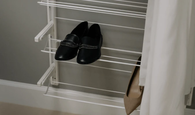 pair of shoes in a shoe rack