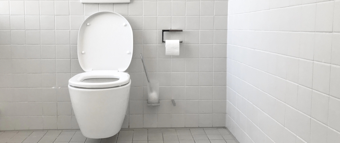 Clean Bathroom With White Tiles