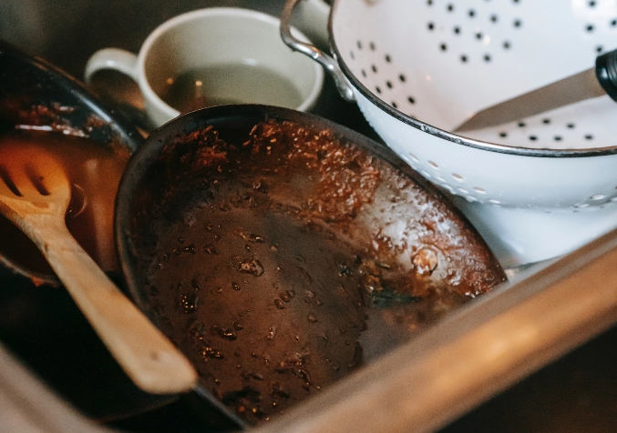 how to remove baked on food from cookware