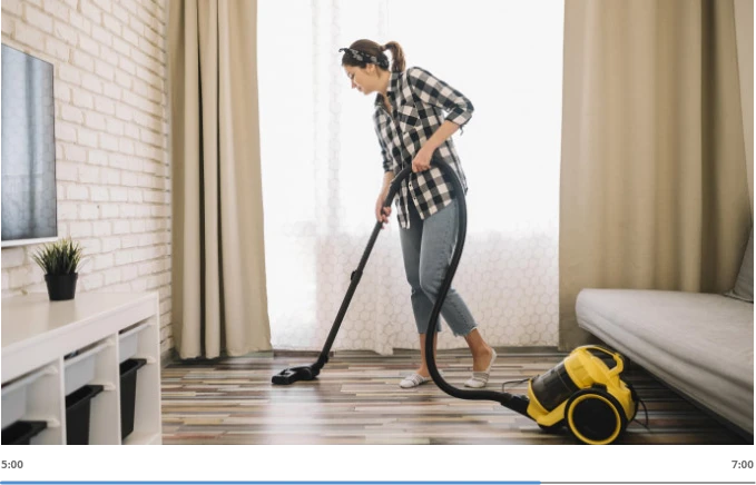woman vacuuming floors