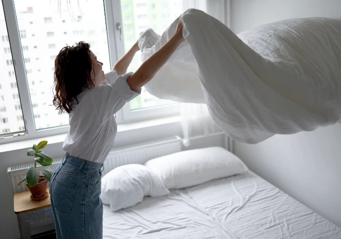 women make bed