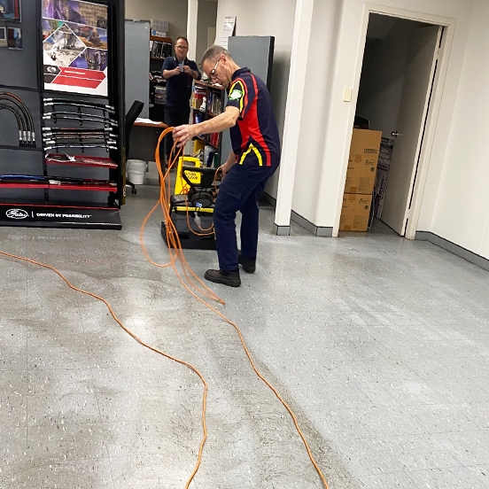 Electrodry Technician Abrading Vinyl Floors To Prepare For Strip And Seal