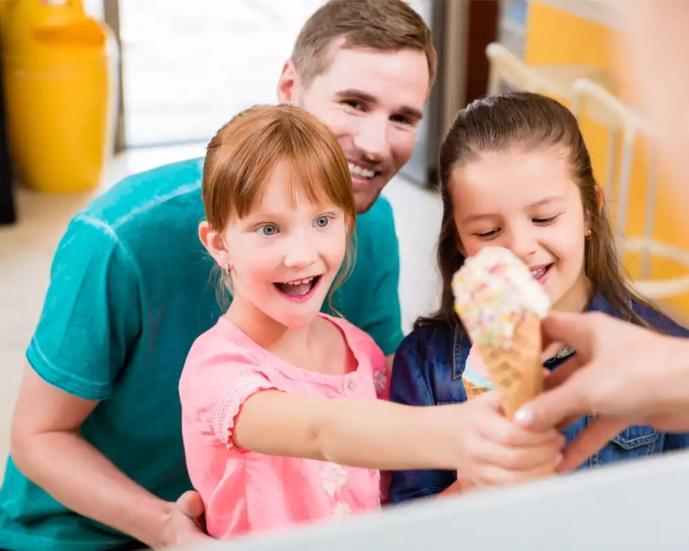 girl receiving ice cream as a reward for cleaning