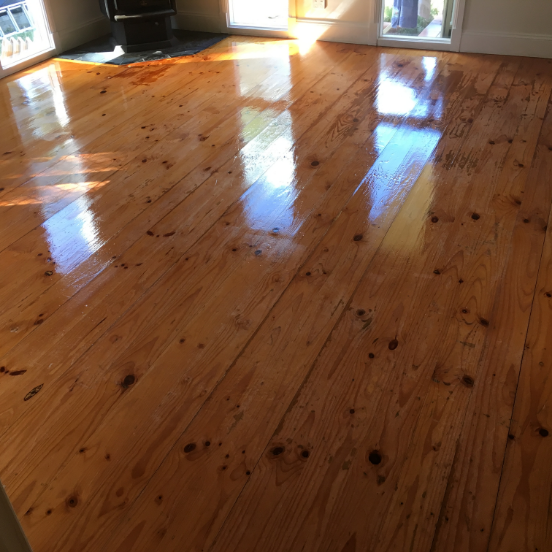 Living Room With Worn Timber Floors After Timber Refresh