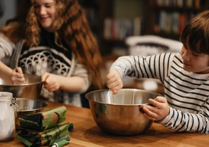 teenage kids making dinner