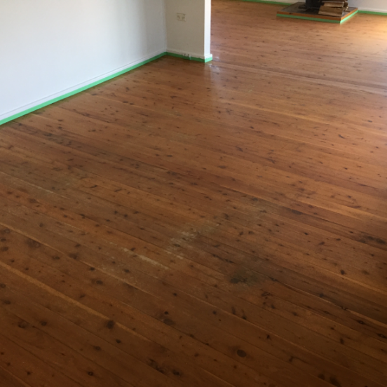 Living Room With Scratched Timber Floor Before Timber Restore