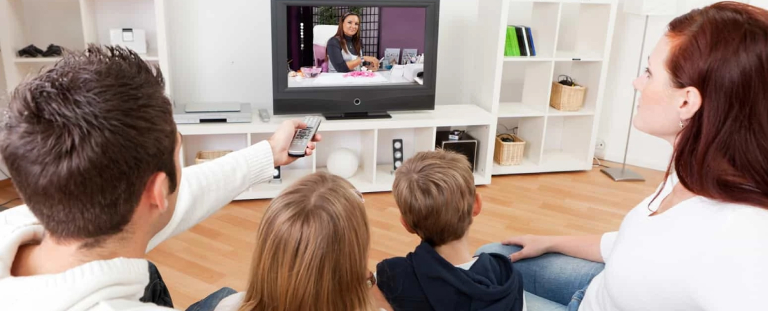 family watching ad break on tv