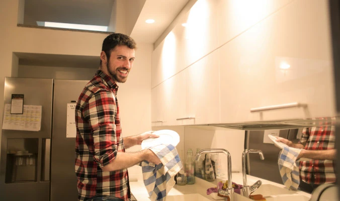 man doing dishes