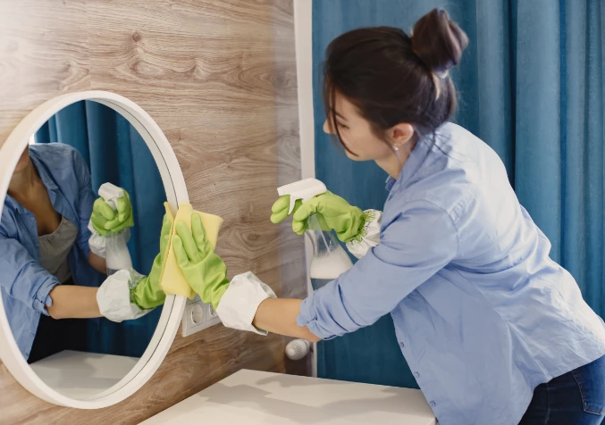 woman tidying bathroom