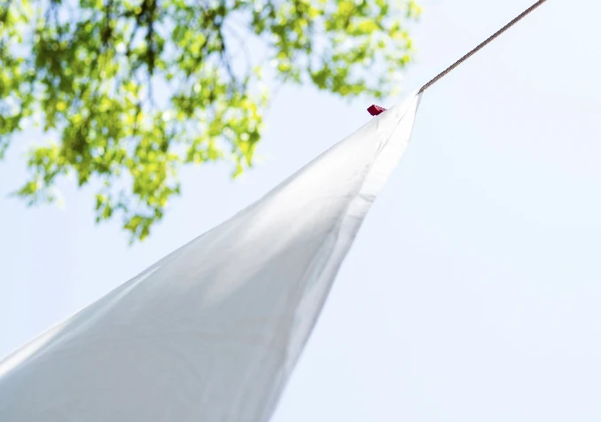 bed sheet drying in the sun
