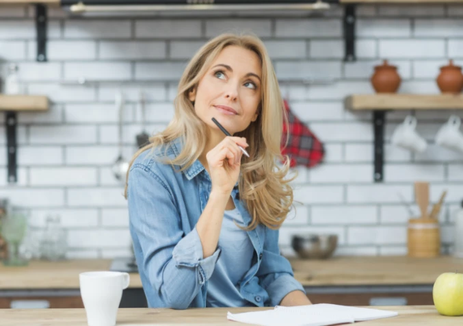 woman making a cleaning list