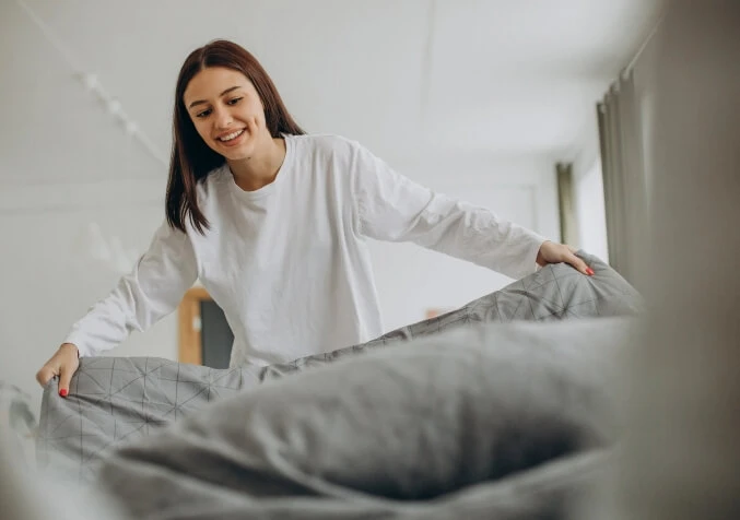 woman changing beddings