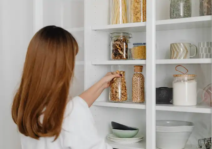 woman organising a pantry