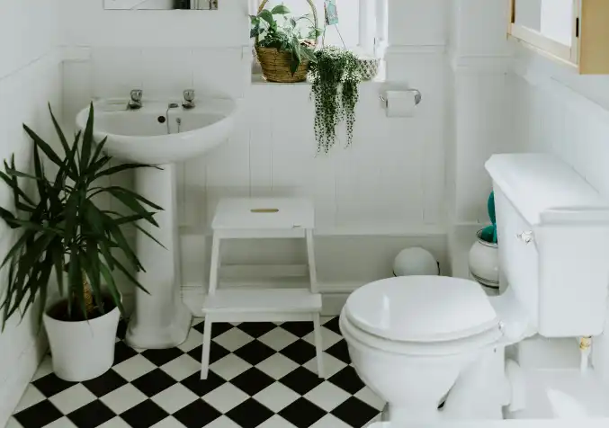 clean bathroom with checkered black and white tiles