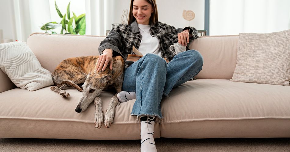 Woman with dog on couch