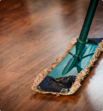 Wood Floor With Old Green Mop