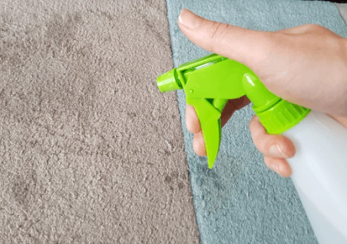 generously spray the cleaning solution on the stain