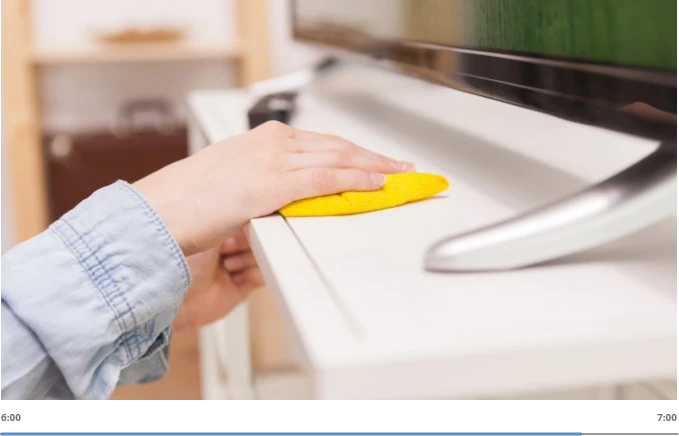 hand wiping tv rack