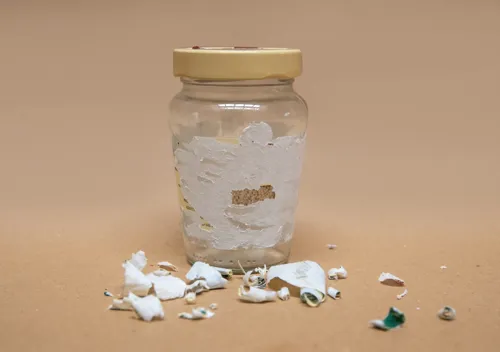 Removing sticky label residue from glass using rubbing alcohol