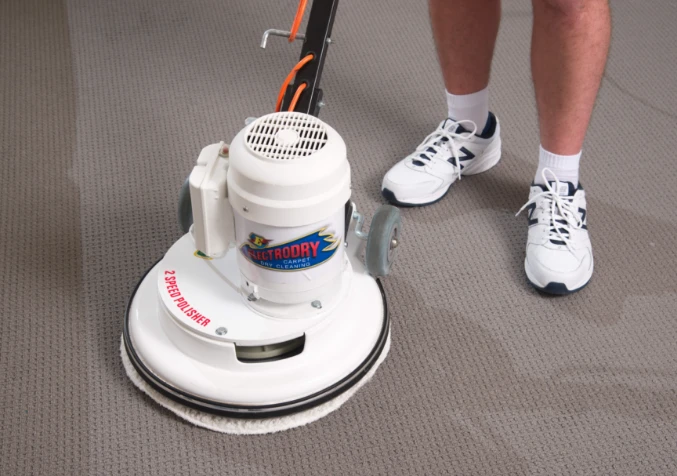 carpet cleaning technician with rotary machine
