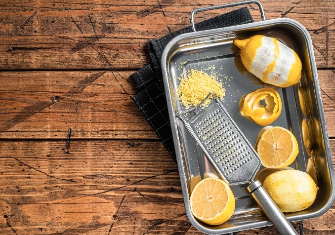 cleaning cheese grater with lemons