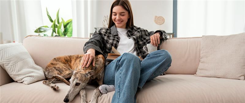 Woman with dog on couch
