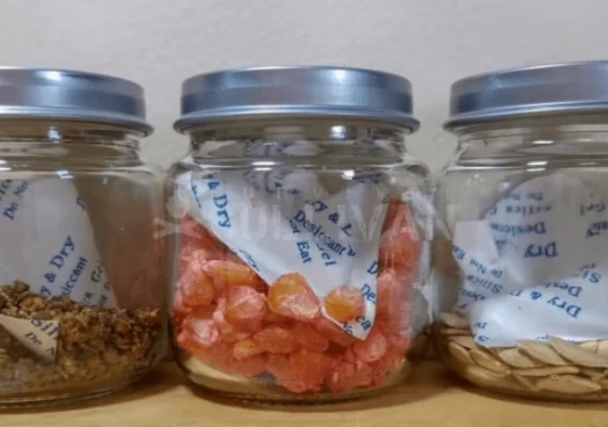 dried fruit and nuts placed in glass jars with silica gel packets