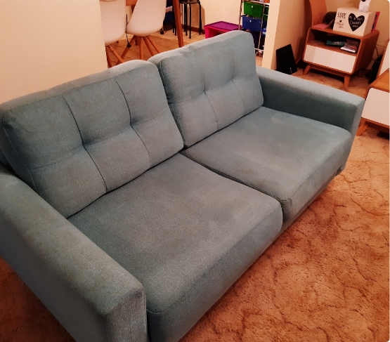 Blue Green Fabric Couch With Stains After Cleaning