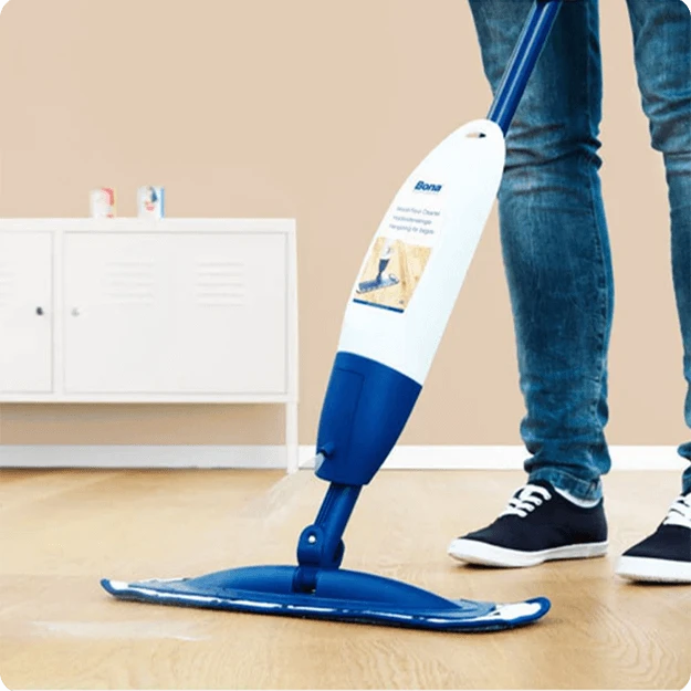 Man Cleaning Wood Floor Using Bona Wood Floor Spray Mop