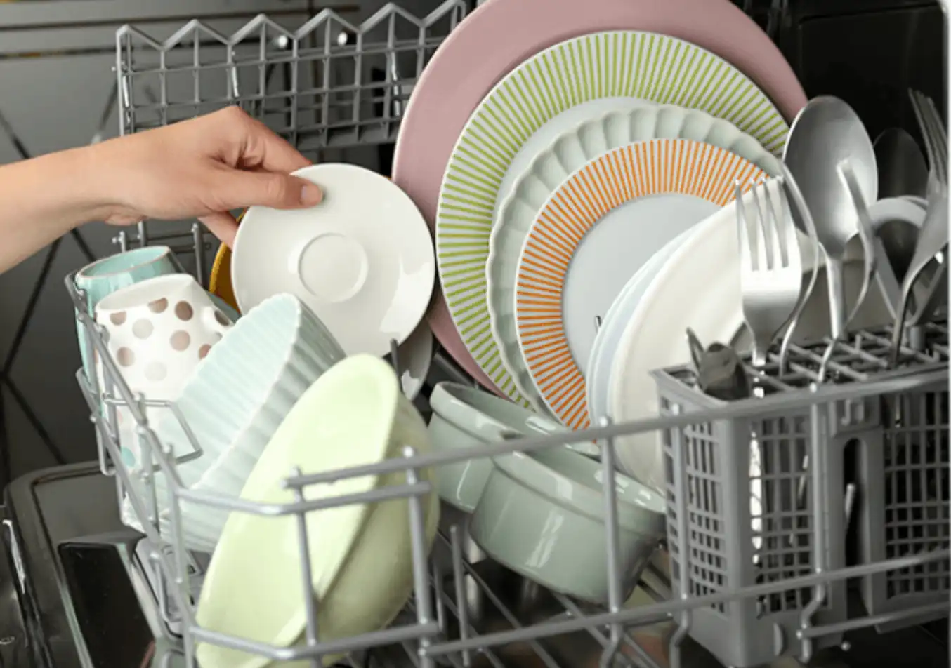 person stacking up dishes