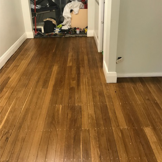 Old Worn And Stained Hallway After Floor Sanding