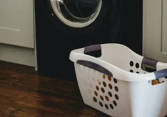 clothes hamper near the washing machine