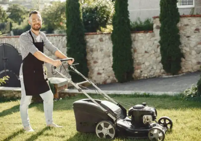 man mowing the lawn for home's aesthetic
