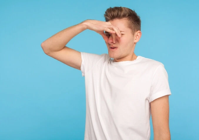 pinching nose because of stinky carpet