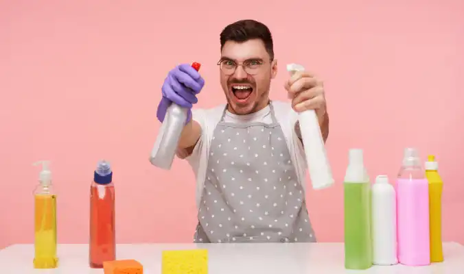 man combining chemicals to clean