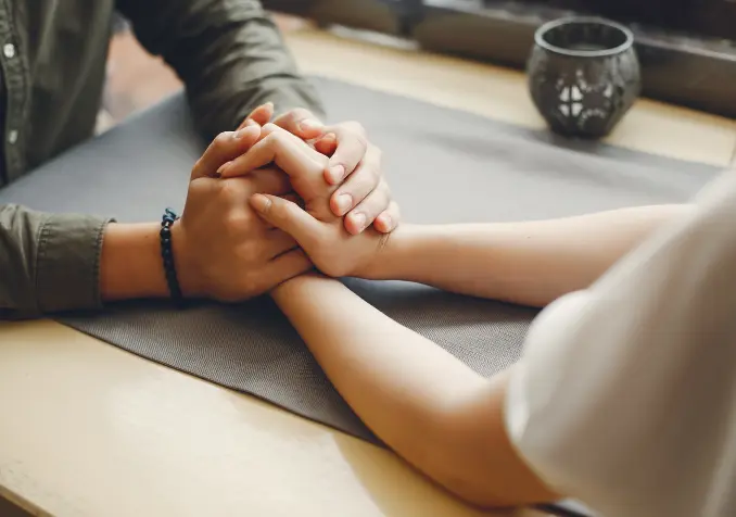 couple with hands clasped