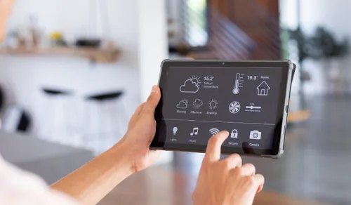 Setting an air conditioner timer or smart control to manage cooling schedule efficiently.