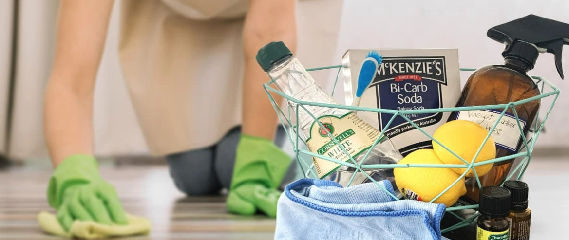 person cleaning the floor using natural cleaning products