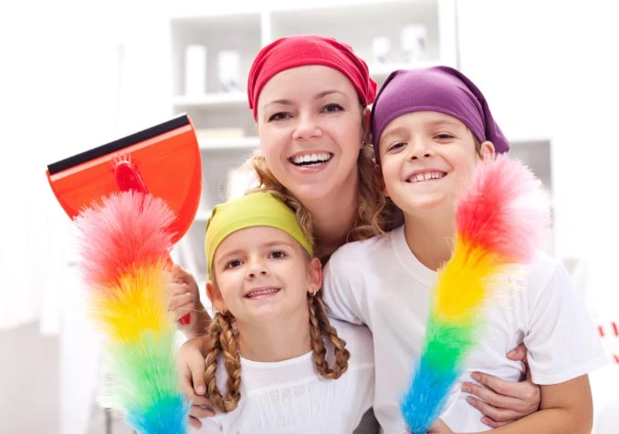 mother and children having fun cleaning