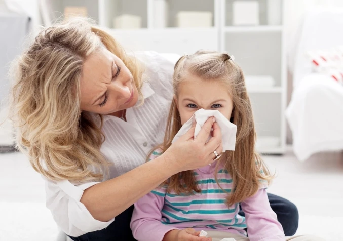 child with runny nose from allergies