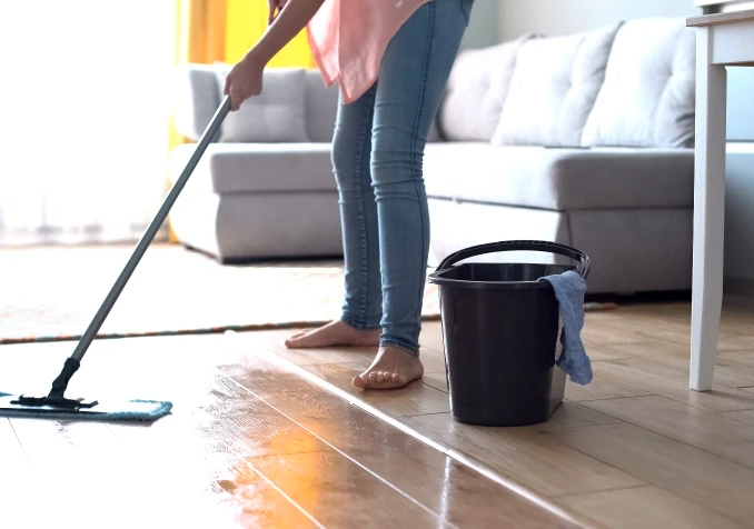 woman mopping timber floors
