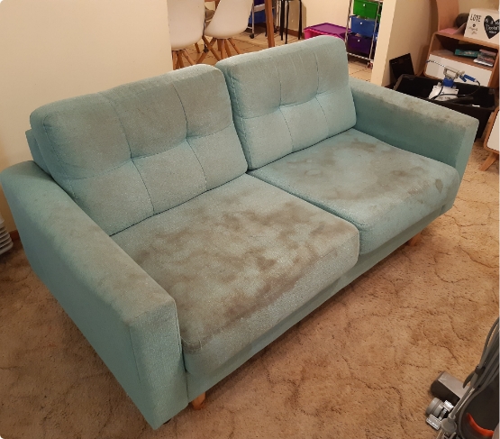 Blue Green Fabric Couch With Stains Before Cleaning