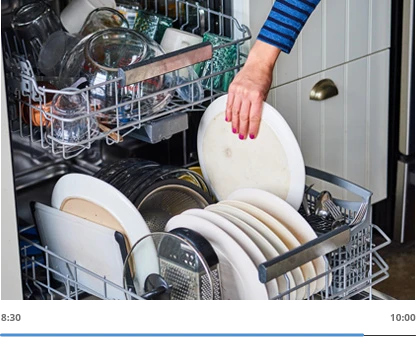 hand putting plate on dish washer