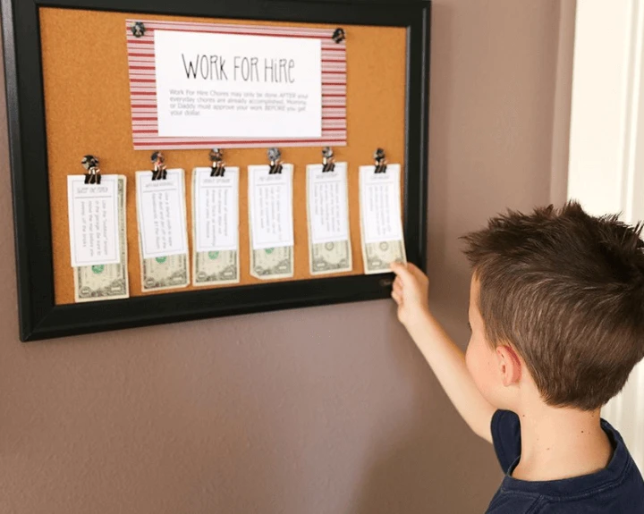 young boy getting his reward placed on a to-do board