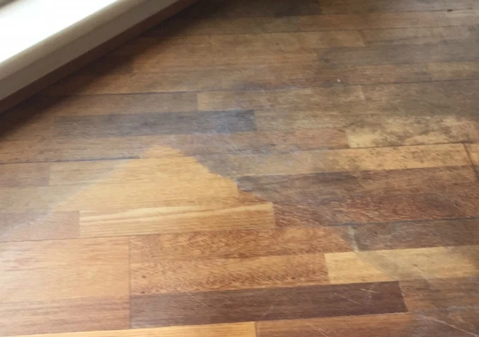 hardwood floors with uneven colour due to wax build up