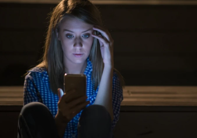 woman researching ways to treat baby vomit stains on internet