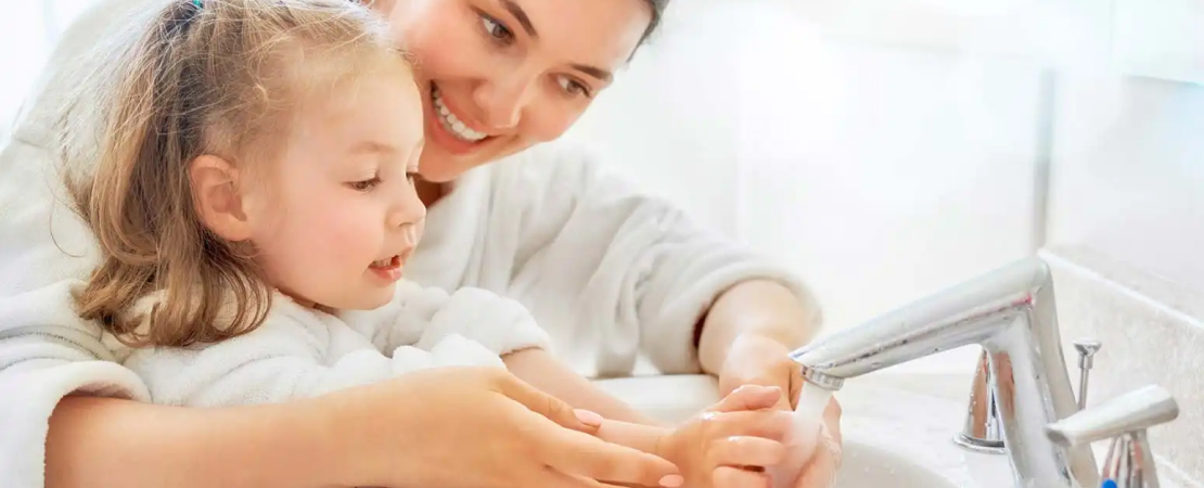 teaching a child to wash hands